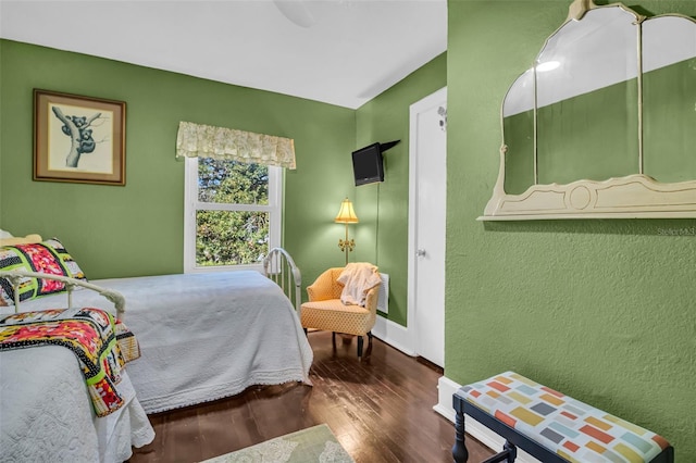 bedroom featuring dark wood-type flooring