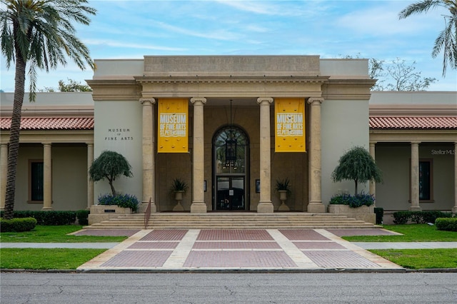 entrance to property featuring stucco siding