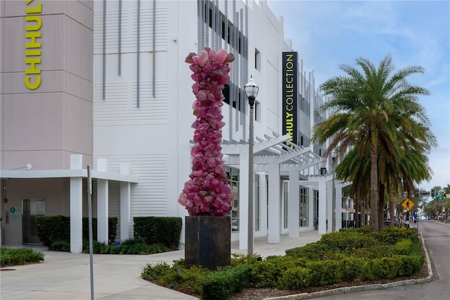 view of building exterior with concrete driveway