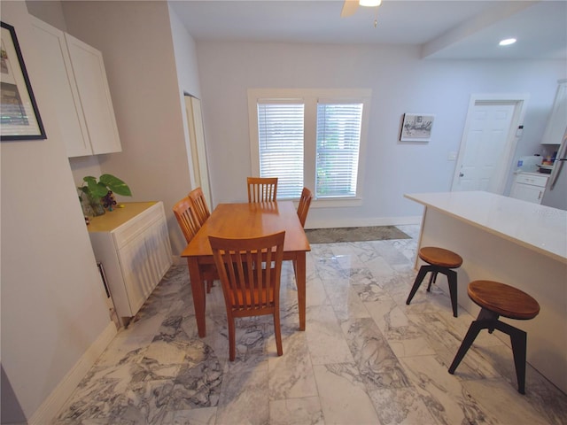 dining space featuring ceiling fan