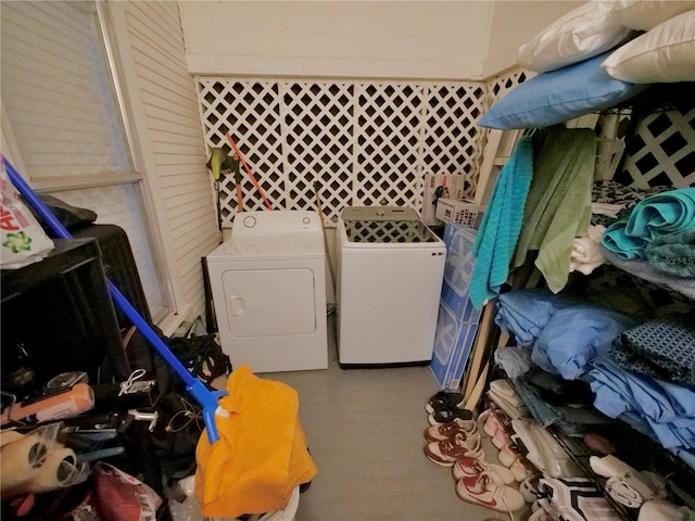 clothes washing area with washer and dryer