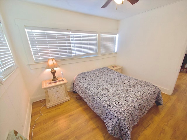 bedroom featuring light hardwood / wood-style floors and ceiling fan