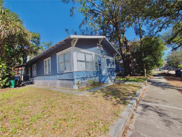 view of front of home with a front lawn