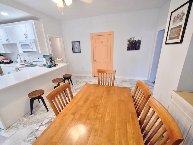 dining area featuring ceiling fan