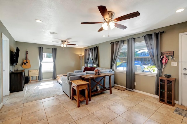 tiled living room featuring ceiling fan