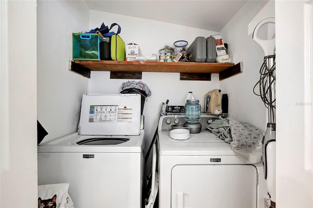 washroom featuring washing machine and dryer