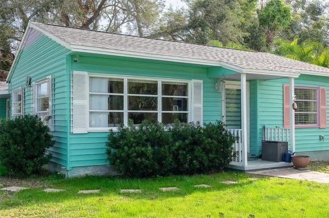 view of property exterior with a yard