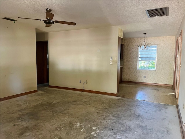 spare room with concrete flooring, ceiling fan with notable chandelier, and a textured ceiling