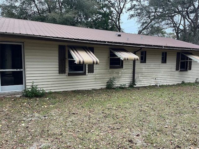 view of home's exterior featuring a yard