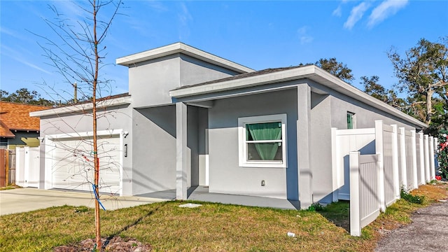 exterior space with a garage and a front lawn