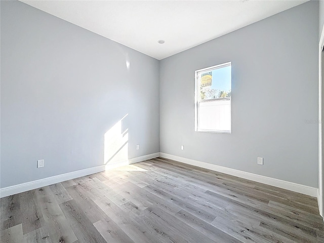 empty room with light hardwood / wood-style floors