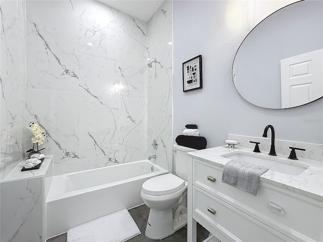 full bathroom with tiled shower / bath combo, vanity, and toilet