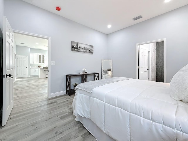 bedroom with light hardwood / wood-style floors