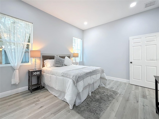 bedroom with light hardwood / wood-style flooring