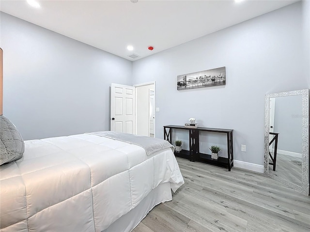 bedroom with light hardwood / wood-style floors