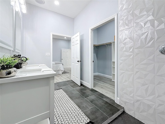 bathroom with vanity and wood-type flooring