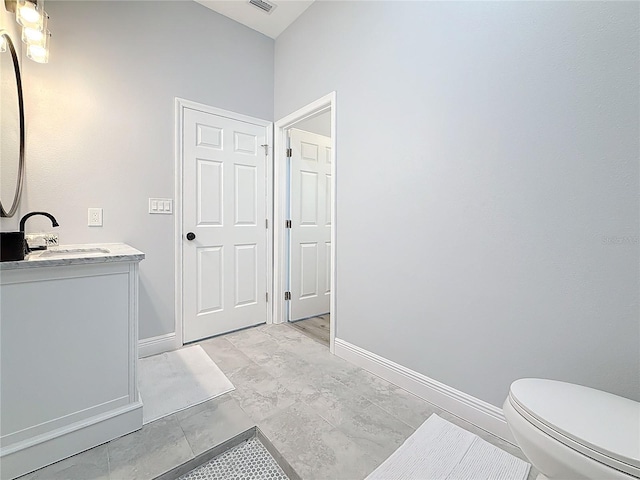 bathroom with vanity and toilet