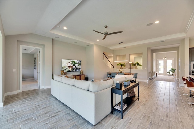 living room featuring ornamental molding, ceiling fan, and french doors