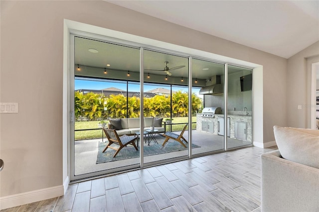 doorway to outside featuring sink