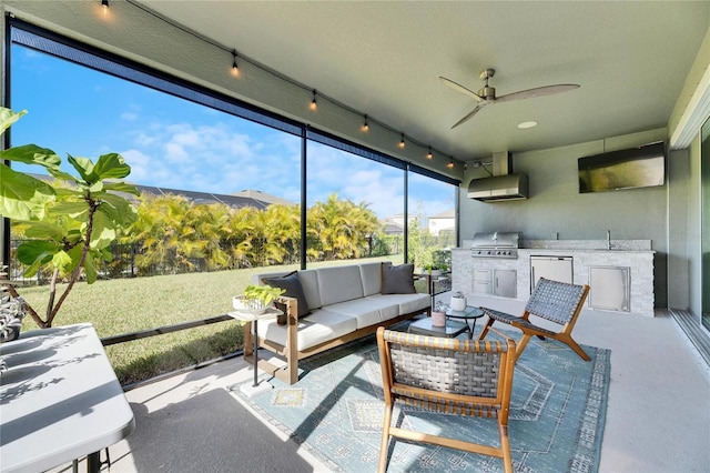 sunroom / solarium featuring sink and ceiling fan