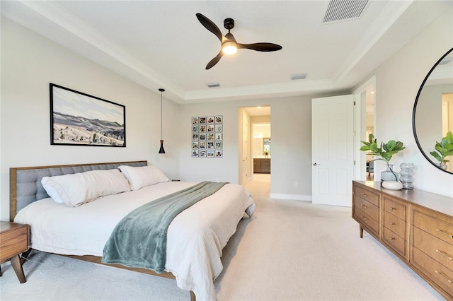 bedroom with ceiling fan, ornamental molding, a tray ceiling, and light colored carpet