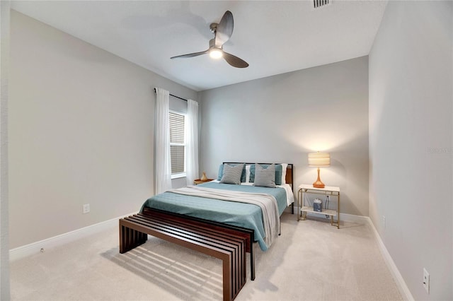 bedroom with light carpet and ceiling fan