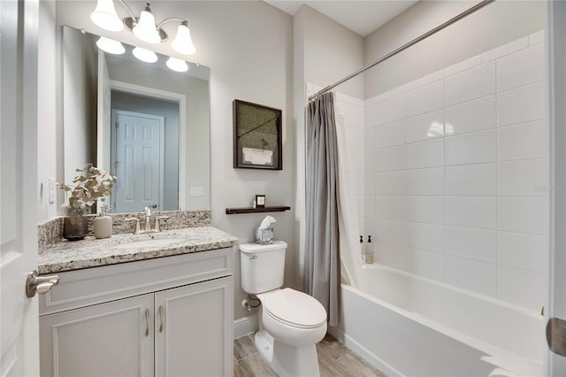 full bathroom featuring shower / tub combo with curtain, vanity, and toilet