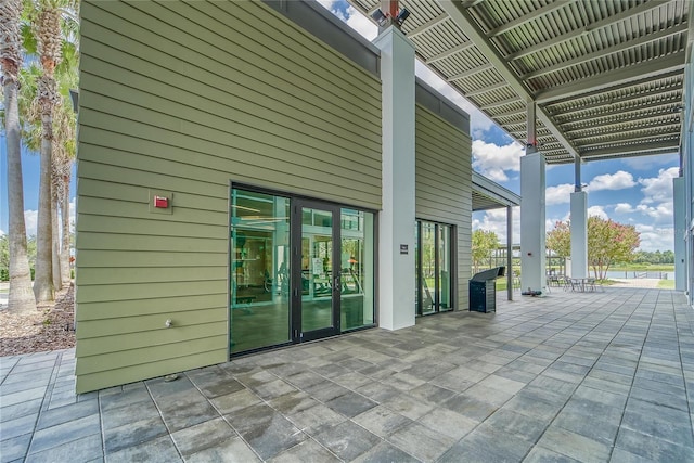 view of patio / terrace featuring a pergola and french doors