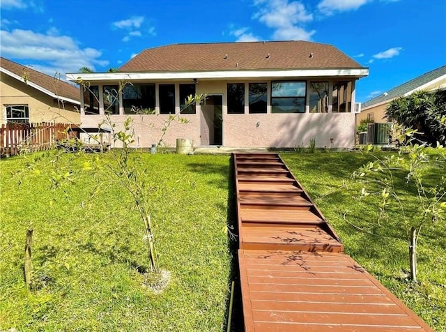 back of property with central AC unit