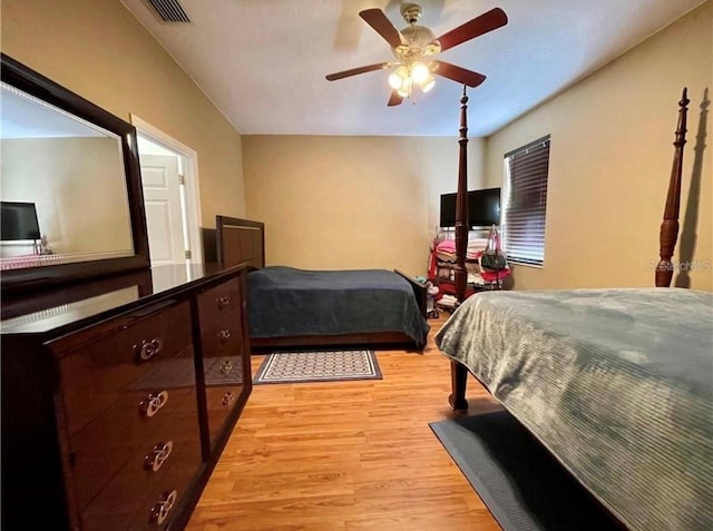 bedroom with ceiling fan and light hardwood / wood-style flooring