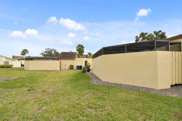 view of yard with a lanai