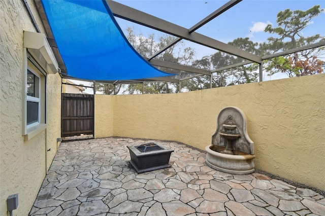 view of patio featuring a fenced backyard and a fire pit