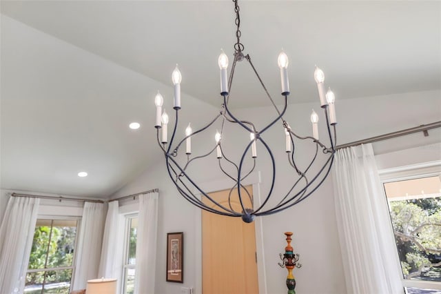 interior details featuring an inviting chandelier