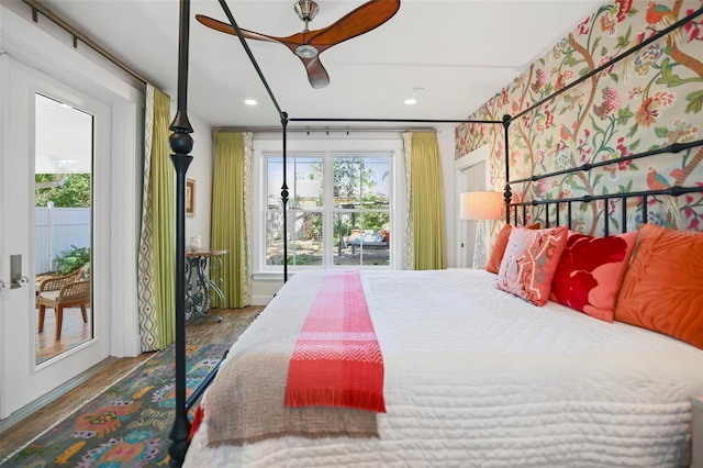 bedroom featuring access to outside, wood finished floors, and recessed lighting