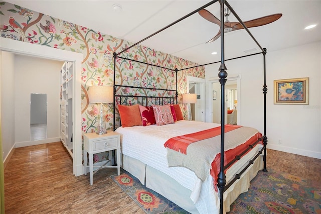 bedroom with hardwood / wood-style flooring and ceiling fan