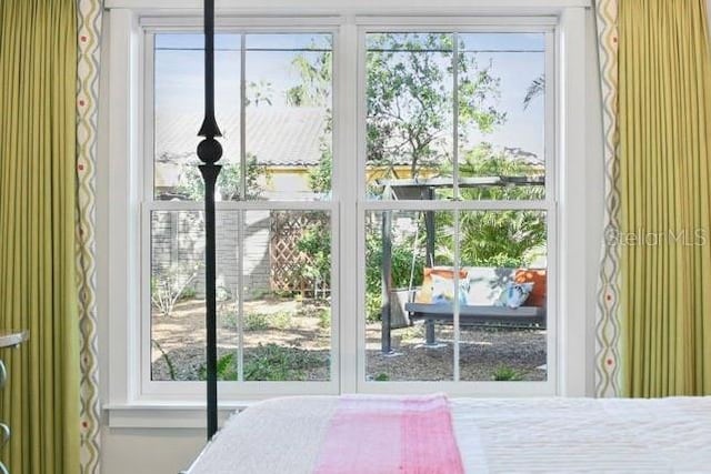 bedroom featuring multiple windows