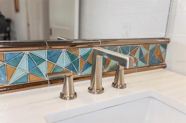 details with backsplash and a sink