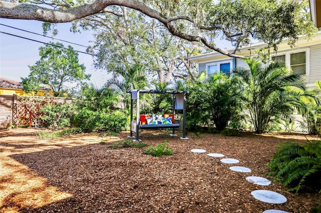 view of yard with fence and an outdoor living space