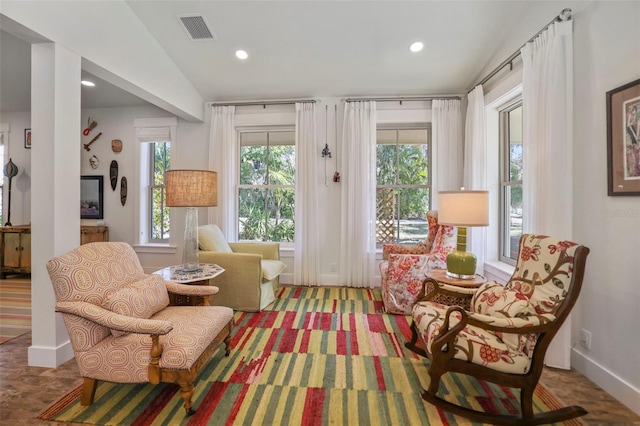 sitting room featuring lofted ceiling, baseboards, visible vents, and recessed lighting