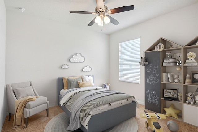 bedroom featuring carpet flooring, a ceiling fan, and baseboards