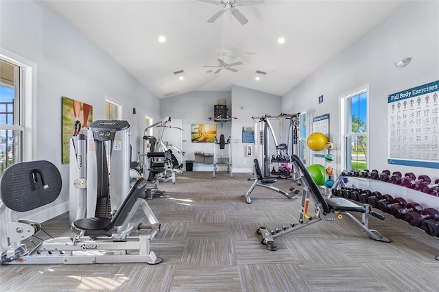 gym with high vaulted ceiling, a wealth of natural light, baseboards, and carpet