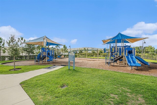 community playground featuring a yard