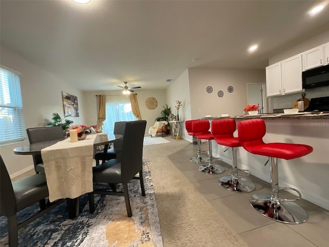 dining space featuring baseboards