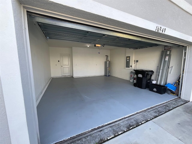 garage with a garage door opener, water heater, and electric panel