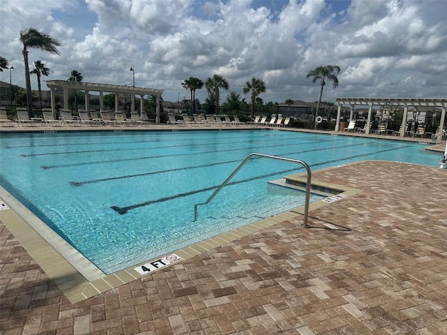 community pool featuring a patio and a pergola