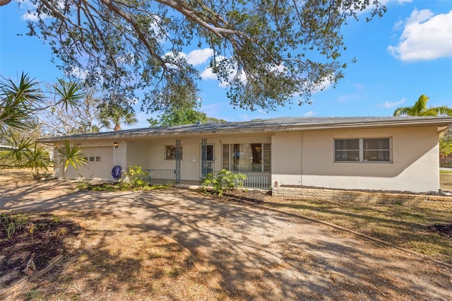 view of front of home with a garage and covered porch