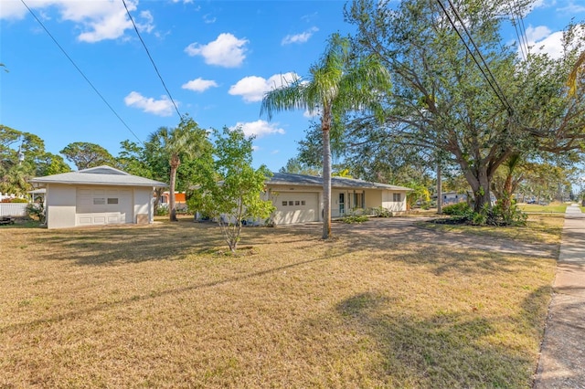 exterior space featuring a yard and a garage