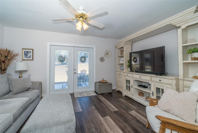 living room with dark hardwood / wood-style floors, ceiling fan, and french doors