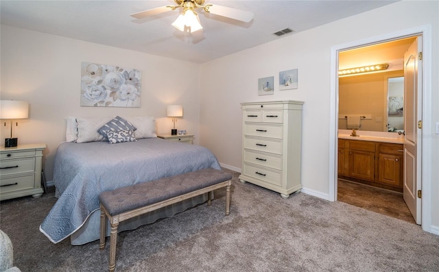 carpeted bedroom featuring connected bathroom and ceiling fan