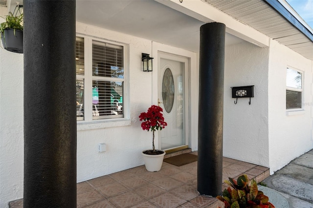 doorway to property featuring a porch